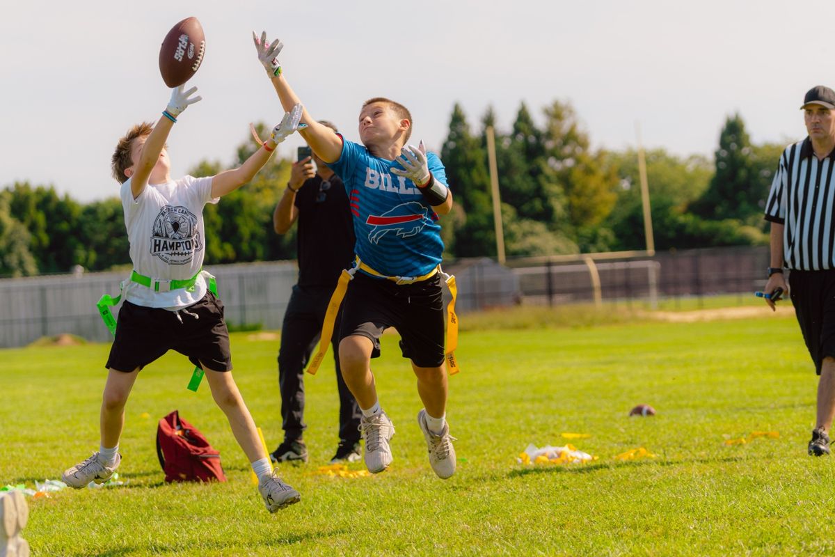 Two players leap for a contested catch
